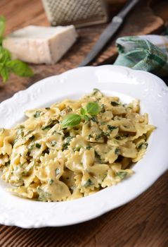 Farfalle pasta with fresh spinach and gorgonzola cheese