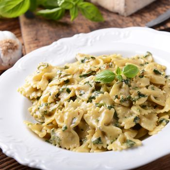 Farfalle pasta with fresh spinach and gorgonzola cheese
