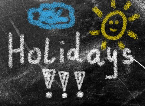 summer concept - holidays word on chalkboard