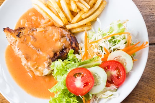 Grilled chicken steak in tomato's sauce, stock photo