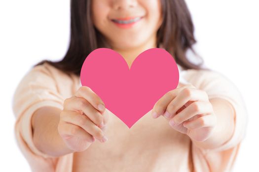 Woman holding pink heart