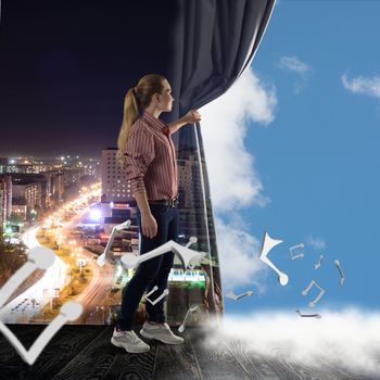 image of a young woman pushes the curtain looking at clouds