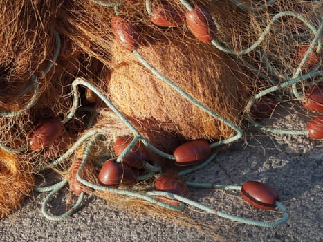 old fishing net with buoys in the port