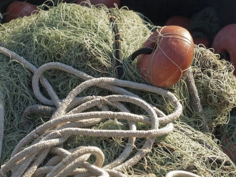 old fishing net with buoys in the port