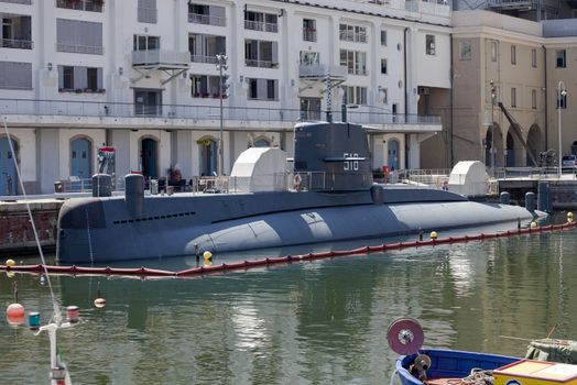 GENOA, ITALY - JUNE 16, 2012: Italian Navy Nazario Sauro class submarine converted to museum (Galata Sea Museum) in Genoa old port.