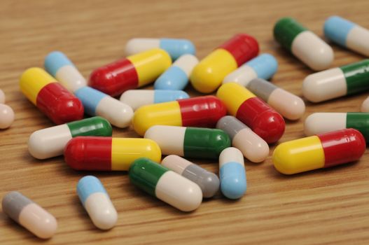 Some capsules and pills on white background