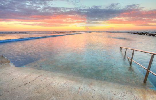 Beautiful morning for a swim.  Sunrise from the Narrabeen Ocean Baths , North Narrabeen NSW Australia