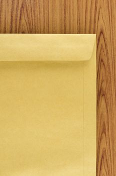 brown envelope on wood table background