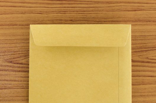brown envelope on wood table background