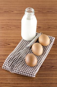 whisk egg and milk concept tools for baking beakery