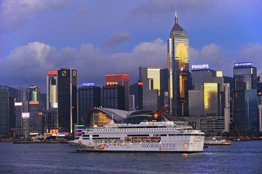HONG KONG - JULY 4: Victoria Harbor on July 04, 2012 in Hong Kong. Cruise Ship "Star Pisces" departed from Ocean Terminal and drove across Victoria Harbor.