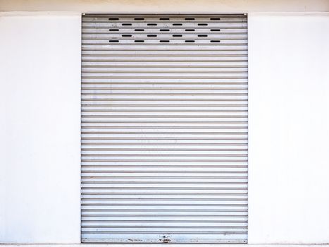 Gray steel overhead door in an exterior wall
