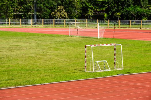 three size of football goal in same soccer field