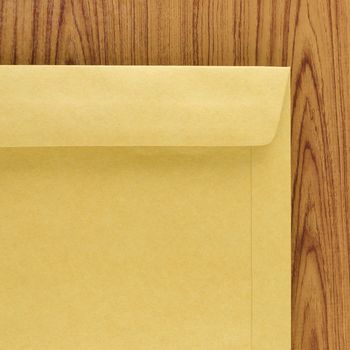 brown envelope on wood table background