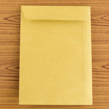 brown envelope on wood table background