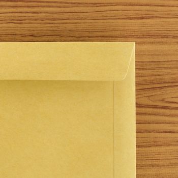 brown envelope on wood table background