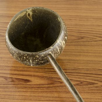 thai wood bowl container for drinking water on wood background