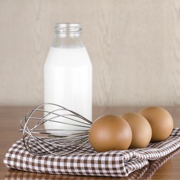 whisk egg and milk concept tools for baking beakery