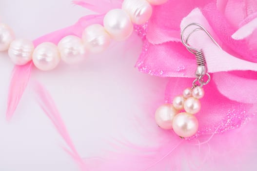 white pearl earrings and necklace