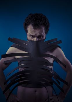 Bdsm, man covered with black strips, shibari concept art