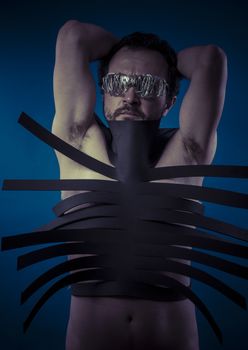 Bdsm, man covered with black strips, shibari concept art