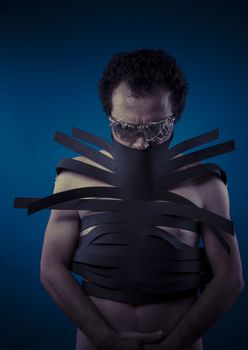 Bdsm, man covered with black strips, shibari concept art