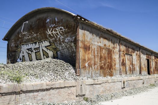 old abandoned train station, rusty iron walls
