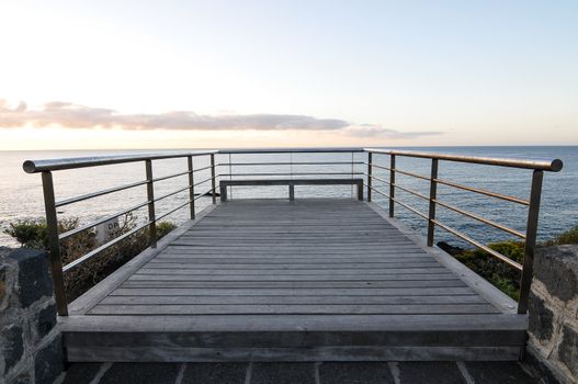 Sunrise on a Pier over Atlantic Ocean in Tenerife Canary Islands Spain