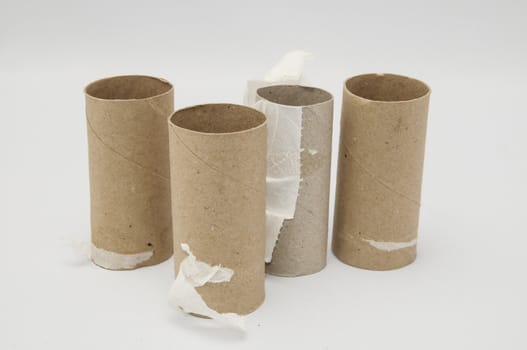 Empty Toilet Rolls Stack Up On a Black Background