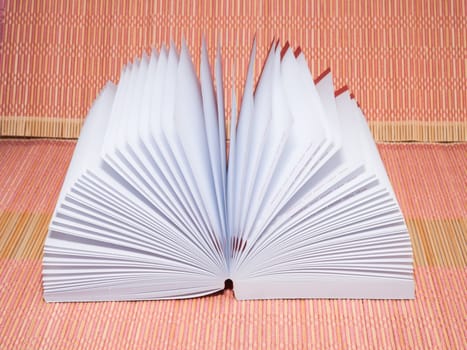 White opened booknote with blank pages