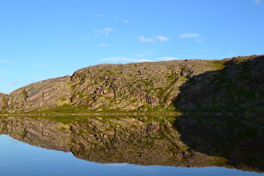 Lake and hill reflection