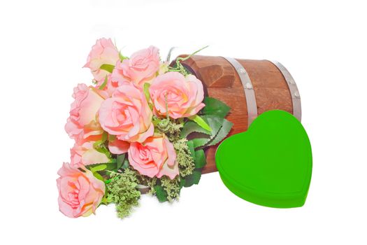 Summer flowers in wooden bucket and heart  on white background
