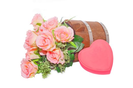 Summer flowers in wooden bucket and heart  on white background