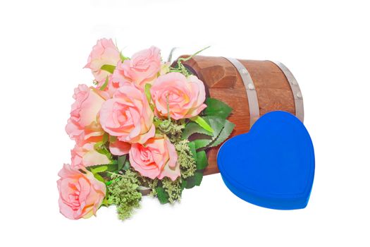 Summer flowers in wooden bucket and heart  on white background
