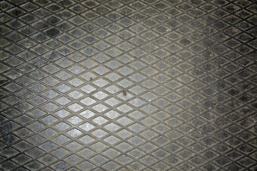 Steel floor pattern industrial background. Car mechanic garage switch to or from summer or winter tires.
