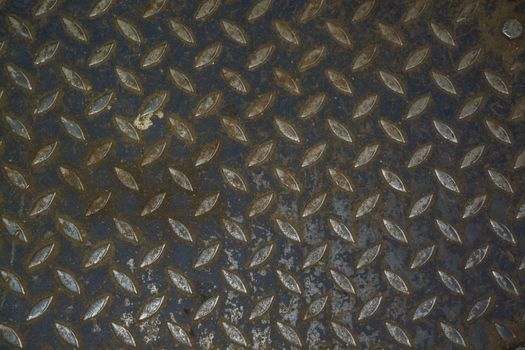 Steel floor pattern industrial background. Car mechanic garage switch to or from summer or winter tires.