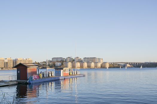 SOLNA, STOCKHOLM, SWEDEN ON APRIL 29, 2014: Gas station with a view over the lake and new residential area Hornsberg on April 29 2014 near Pampas Marina in Solna, Stockholm, Sweden.