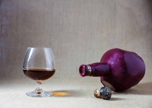 Cognac glass and bottle