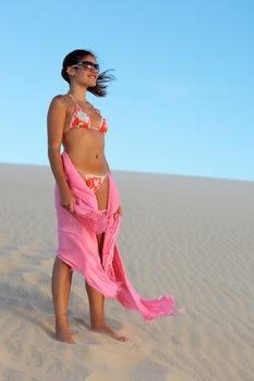 beautiful bikini dressed with a saron young Brazilian woman in jericoacoara at the sunset ceara state near fortaleza