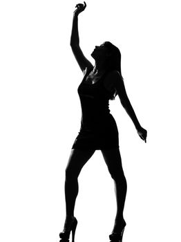 stylish silhouette  beautiful woman dancing full length on studio isolated white background