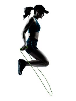 one  woman runner jogger jumping rope in silhouette studio isolated on white background