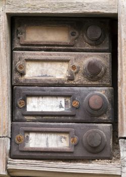 Detail of the old and damaged doorbells