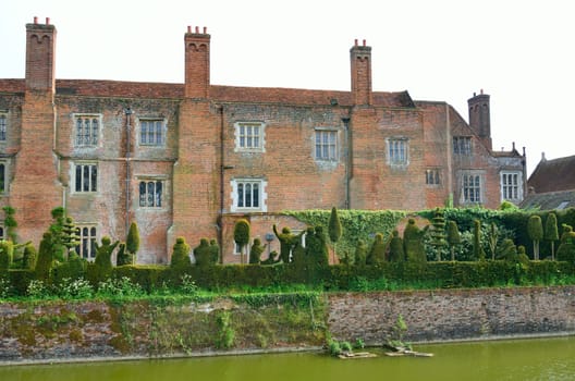 View of english house and hedge