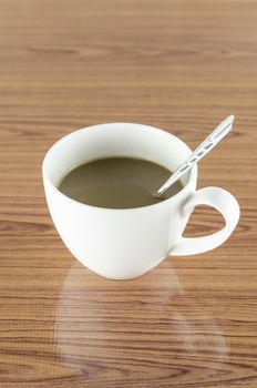 coffee in cup on wood background