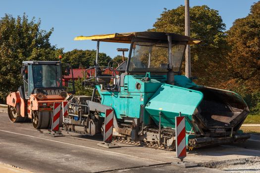 A couple of asphalt paving machines not working