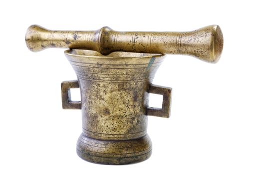 Brass mortar with a pestle isolated on a white background