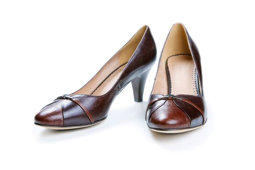 Brown female shoes isolated on a white background