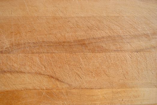 A Colourful Photo of a piece of worn wood from a chopping board