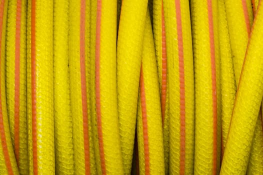 Yellow and orange water hose for watering gardens