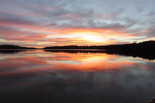 Beautiful sunrise and mirror reflections on Narrabeen Lakes NSW Australia